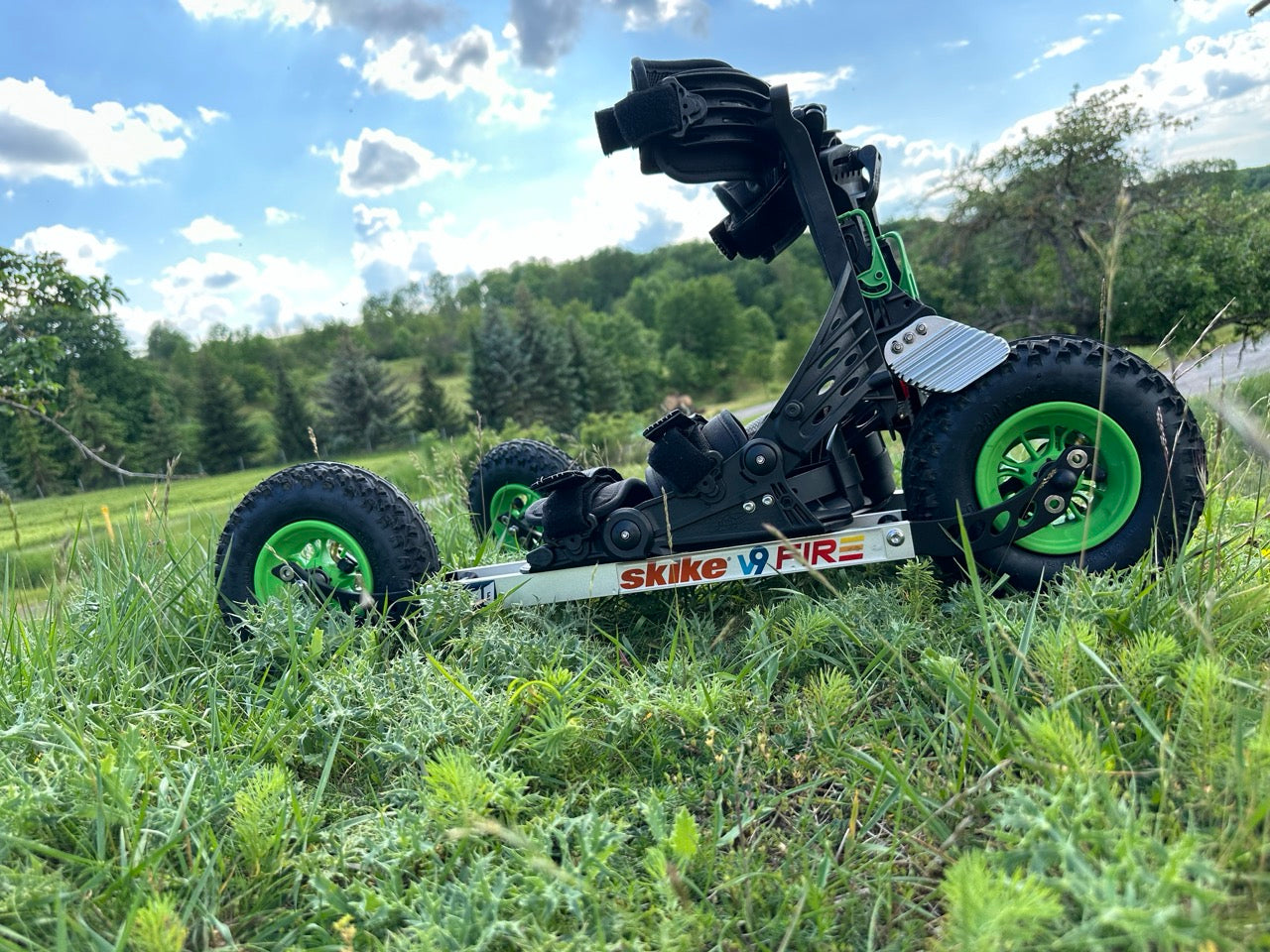 skike v9 FIRE 200 in the grass overlooking a green landscape